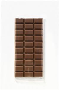 A bar of milk chocolate in cellophane