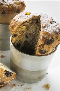 Chocolate panettone, a piece cut, in baking tin