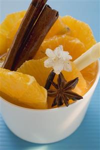 Orange slices with star anise, lemon grass & sugared flower