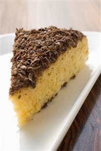 Piece of almond ricotta cake with dark chocolate
