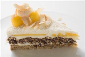 Piece of Creole cake with mango and pecans