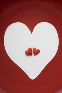 Two red sugar hearts in a white heart