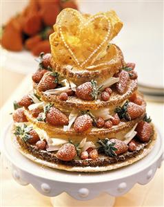 Tiered cake with white chocolate cream and strawberries