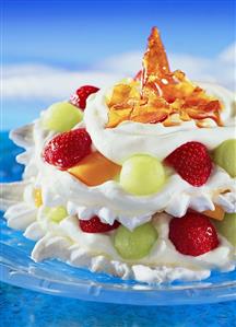 Meringue cream gateau with fruit and spun sugar