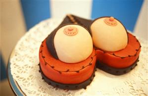 Erotic gateau in shape of heart with bosom decoration