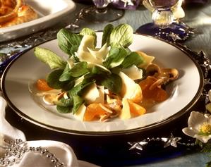 Corn salad with cheese planes and mandarins