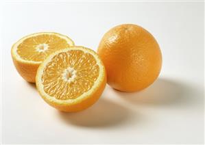 Whole and halved orange