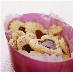 Heart-shaped biscuits with raspberry jam