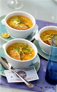 Alphabet soup with duck breast in soup cups