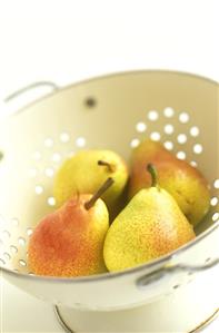 Freshly washed pears in a sieve
