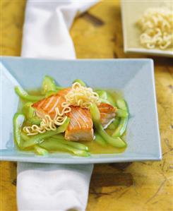 Salmon fillet with stock with cucumber