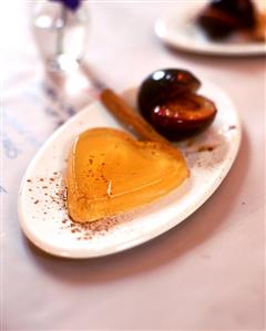 White wine and cinnamon jelly and plums fried in butter
