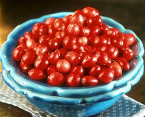 Fresh cranberries in turquoise ceramic bowl