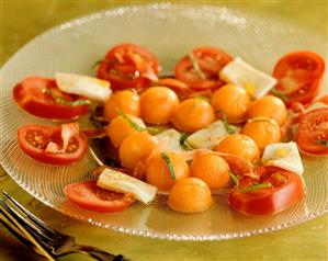 Tomato and mozzarella salad with melon balls