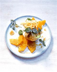 Sweet pastry pouch with vanilla ice cream and orange slices