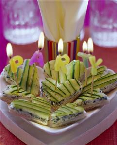 White bread hearts with soft cheese & cucumber slices for party