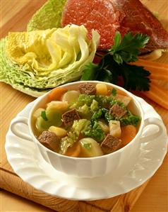 Pot au feu with savoy and beef in a soup cup