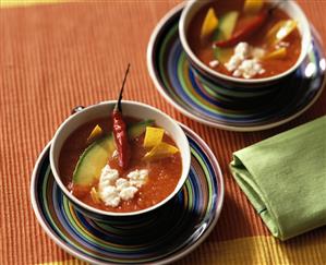 Tomato soup with tortillas, avocado and sheep's cheese