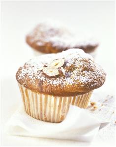 Banana muffins with hazelnuts and icing sugar
