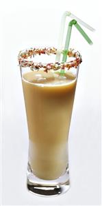 Nectarine buttermilk in glass with coloured sugar sprinkles