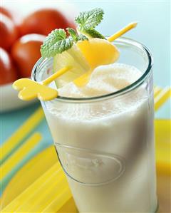 Mandarin milk with skewered fruit and lemon balm