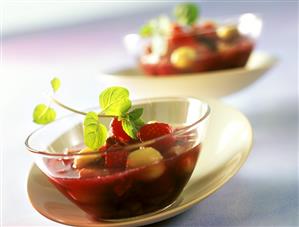 Prosecco soup with fruit and mint leaves