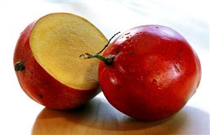 Mangos (Tommy Atkins variety) with drops of water