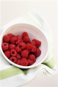 Fresh raspberries in small bowl