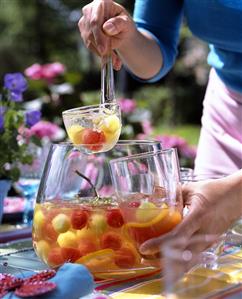 Melon and elderflower punch on table in garden