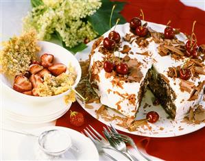 Elderflower fritters with strawberries; Black Forest cherry cake
