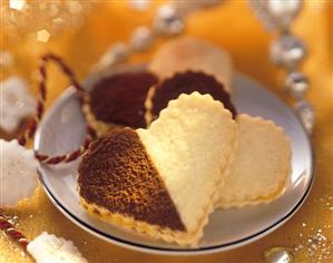 Black and white sweet pastry hearts with jam filling