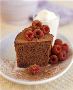 A piece of chocolate cake with raspberries