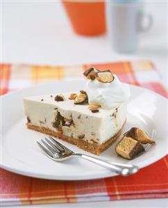 A piece of cheesecake with chocolate crispies