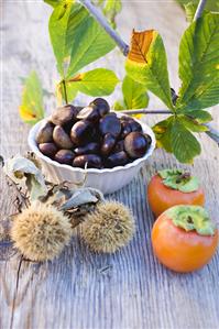 Sweet chestnuts, persimmons and chestnut leaves