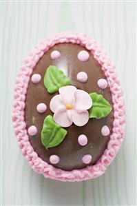 Chocolate Easter egg with sugar flower