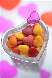 Coloured hearts in a glass dish