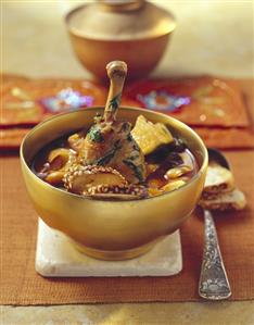 Middle Eastern bean soup with baharat and chicken leg