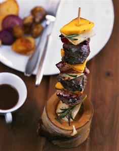 Venison kebab with coffee sauce and potatoes and chestnuts