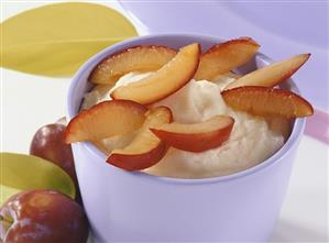 Frozen soft cheese dessert with vanilla and plums