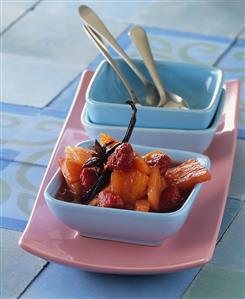Apricot, pineapple & raspberry compote in a small bowl