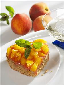 Cocoa sponge heart topped with peaches