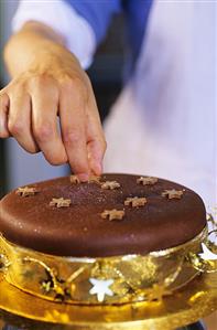 Decorating chocolate cake for Christmas