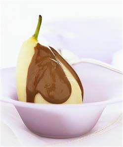 Poached pear with chocolate sauce
