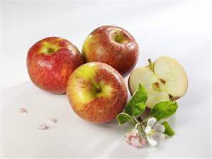 Braeburn apple, three whole and one half