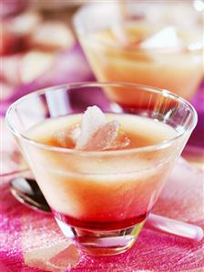 Pink peach soup with rose petals