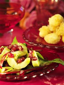 Cucumber with pomegranate seeds and beetroot leaves