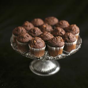 Mini chocolate muffins on a pedestal cake stand