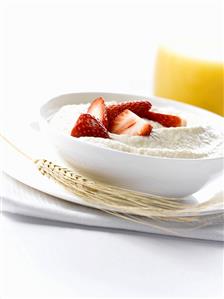 Porridge with fresh strawberries & a glass of orange juice