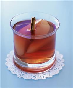 Poached pear in mulled wine jelly in a glass