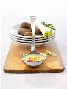 Potato soup with leek in soup ladle